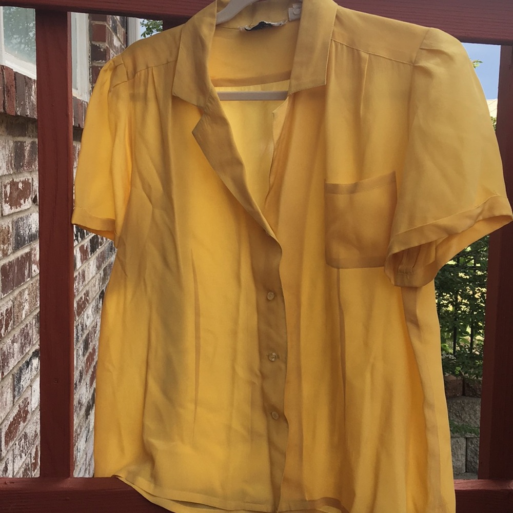 A yellow button up